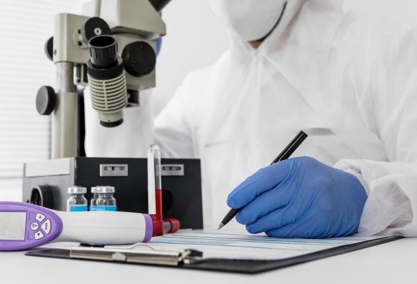 doctor-using-microscope-check-covid-sample_23-2148747864